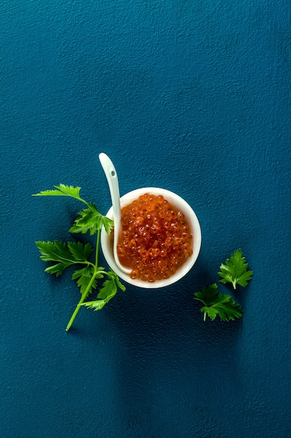 Portion of red caviar on the table