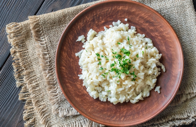 Portion of risotto on the wooden table