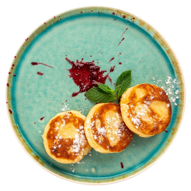 portion of russian cottage cheese pancakes syrniki
