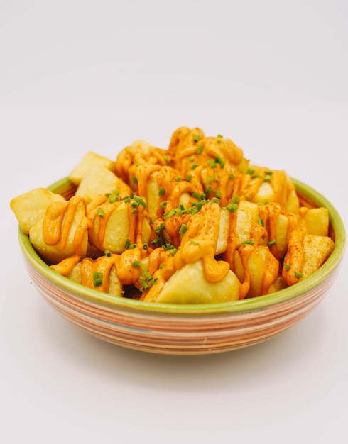 Portion of Spanish patatas bravas with spicy sauce