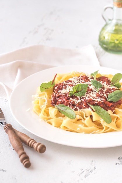 Portion of tagliatelle with bolognese sauce