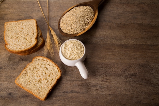 Portion of uncooked Quinoa and wey protein (detailed close-up shot)