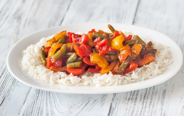 Portion of white rice and fried vegetables