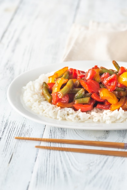 Portion of white rice and fried vegetables