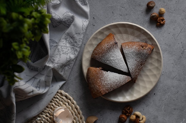 Portioned cake with honeysuckle and nuts