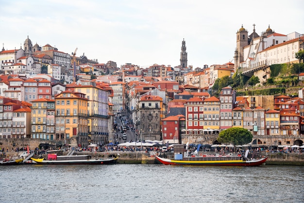 Porto, The Ribeira District, Portugal old town ribeira view with colorful houses, traditional facades, old multi-colored houses with red roof tiles