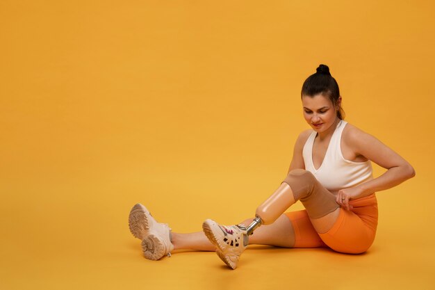 Photo portrait of active disabled woman with prosthetic leg