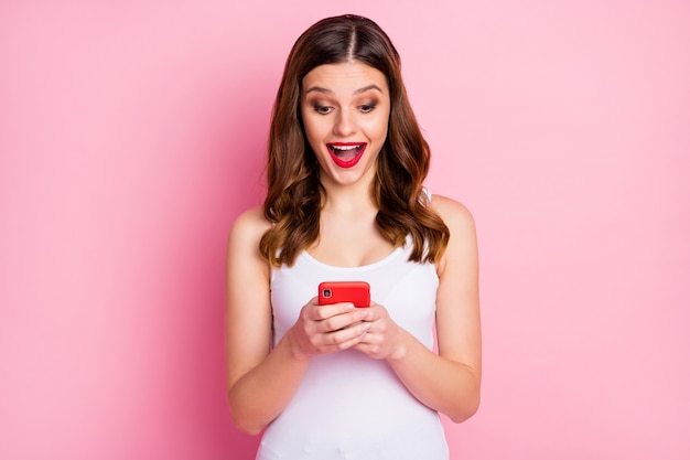 Portrait of addicted girl use smartphone excited crazy girl