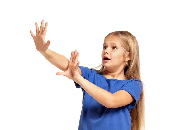 Photo portrait of adorable emotional little girl isolated on a white