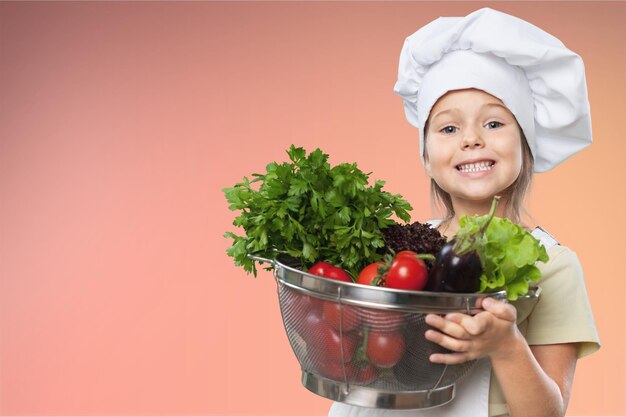 Portrait of adorable little girl preparing healthy food at kitchen