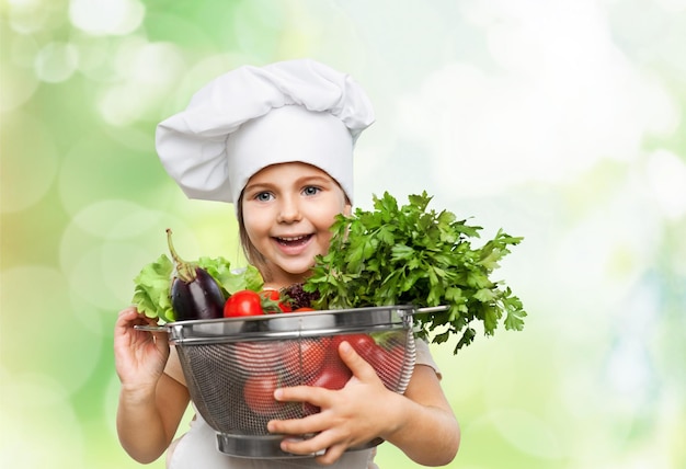 Portrait of adorable little girl preparing healthy food