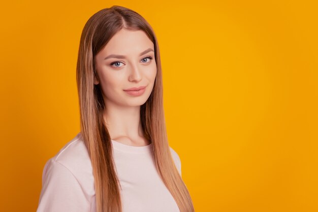 Portrait of adorable sweet girlish lady tender look camera on yellow background