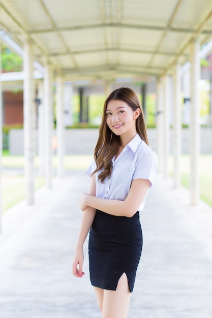 Portrait of an adult Thai student in university student uniform