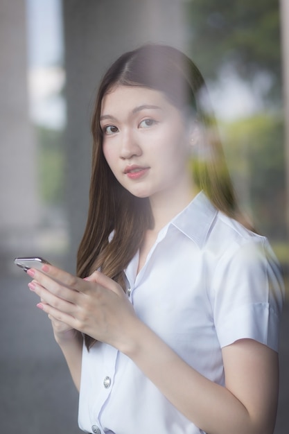 Portrait of an adult Thai student in university uniform