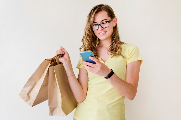 Portrait of adult woman holding shopping bags