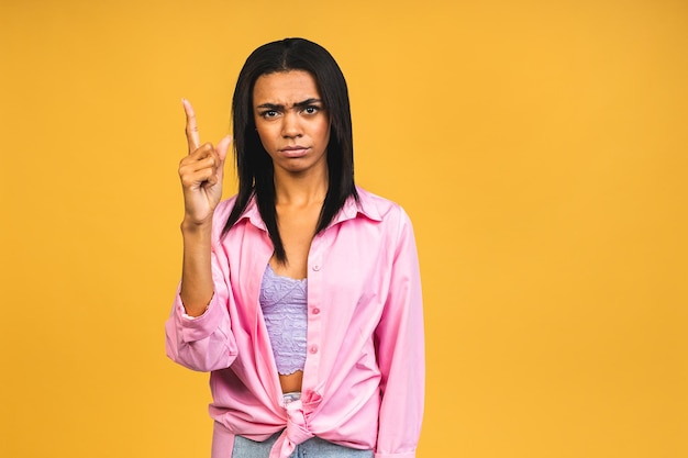 Portrait of african american black woman wearing casual depressed and worry for distress crying angry and afraid sad expression Isolated over yellow background