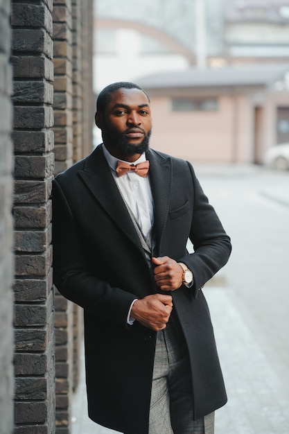 Portrait of an african-american businessman wearing a suit standing in outdoors