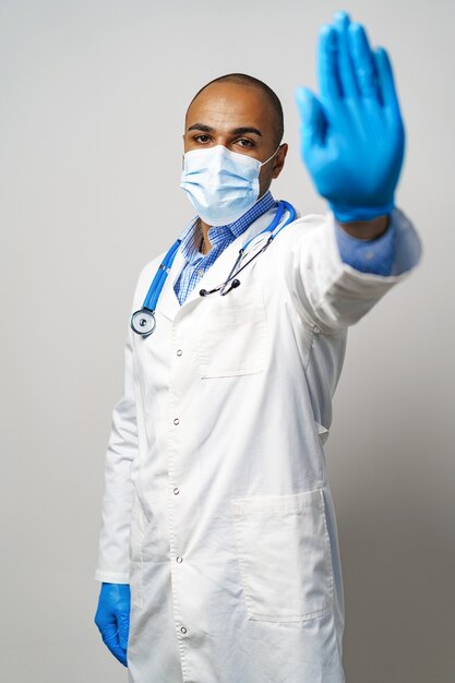 Portrait of african american doctor in medical mask in hospital