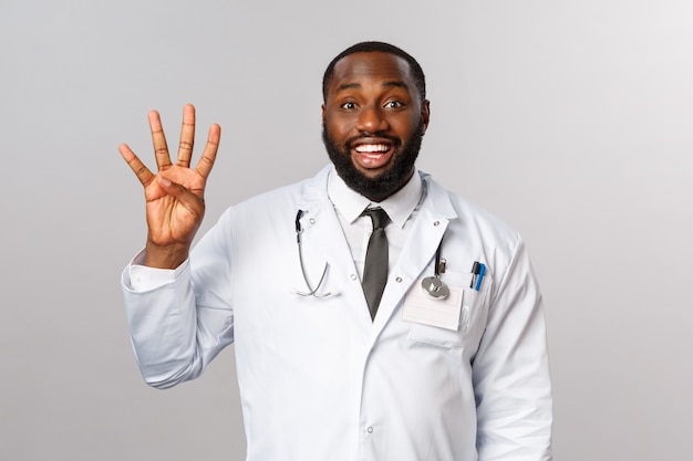 Portrait African American Doctor in white uniform.