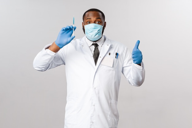 Portrait of a African American doctor with white uniform