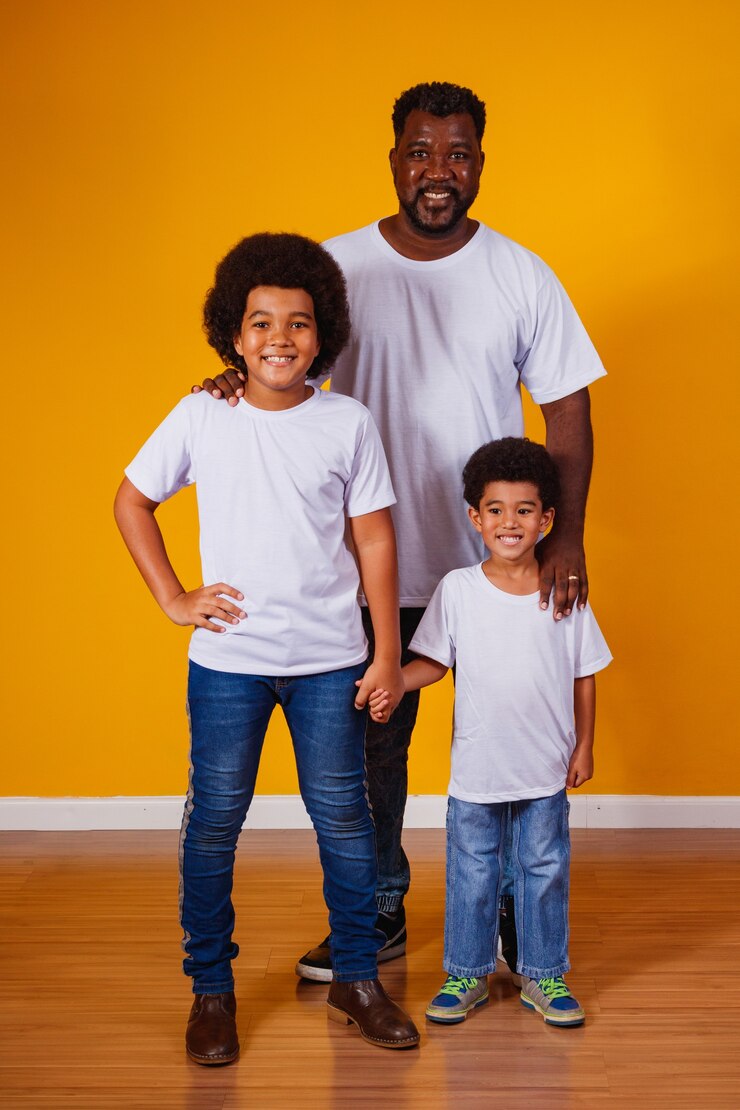 Portrait of African American father with his black children.