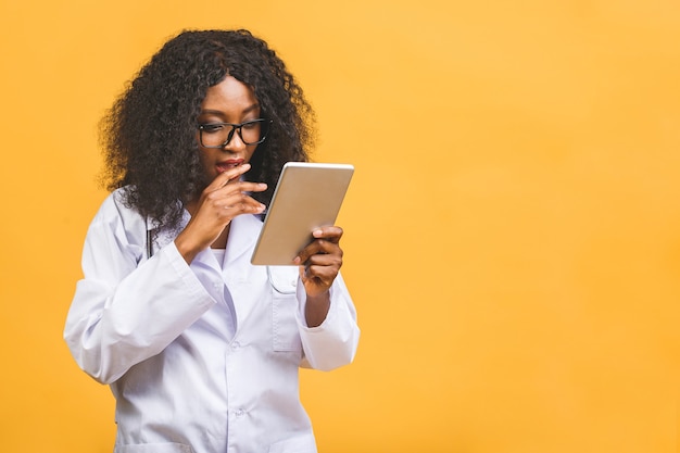 portrait African American female doctor using tablet