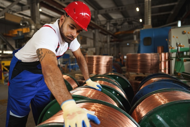 Portrait of african american male handyman working in an industrial factory