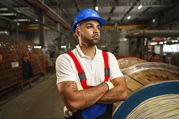 Portrait of african american male handyman working in an industrial factory