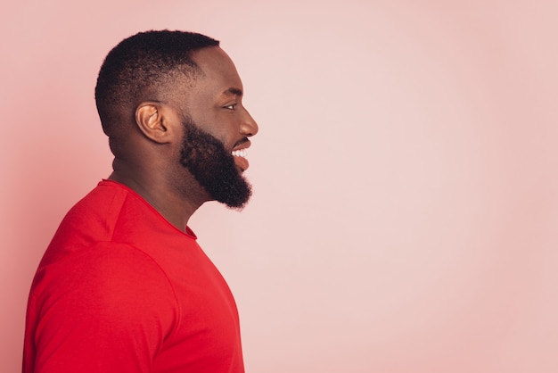 Portrait of african american male look empty space isolated over pink background