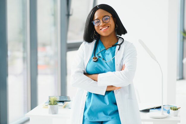 Portrait of African American woman doctor smiling in hospital