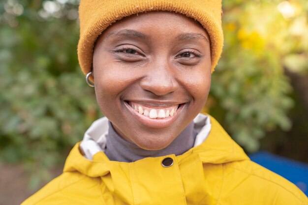 Portrait of african american woman smiling at nature Pleased black girl in love with life