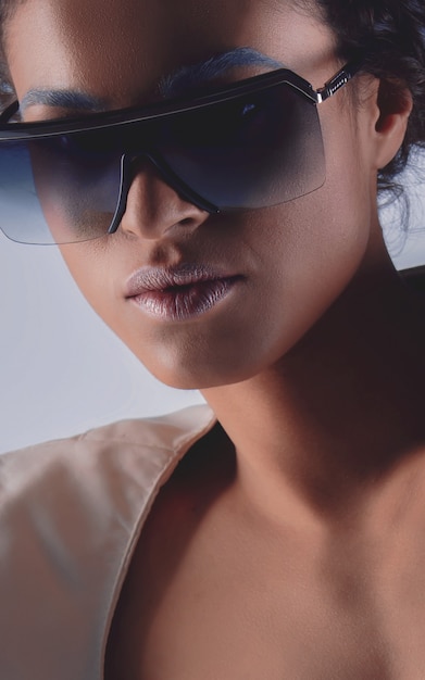 Portrait of african american woman in stylish clothes and sunglasses