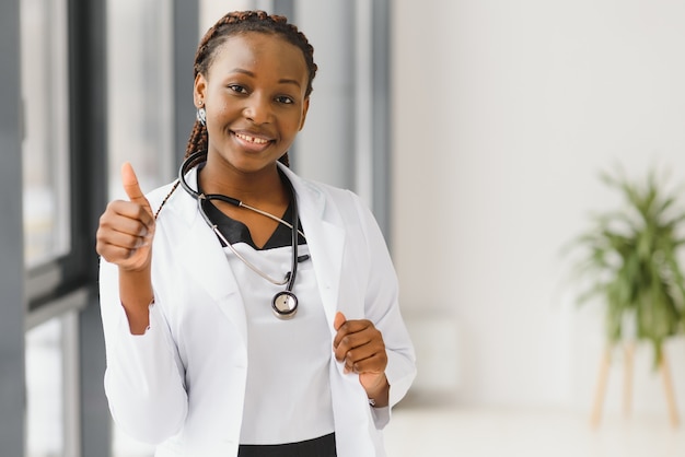 Portrait of african female doctor at workplace