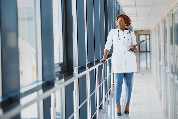 Portrait of african female doctor at workplace