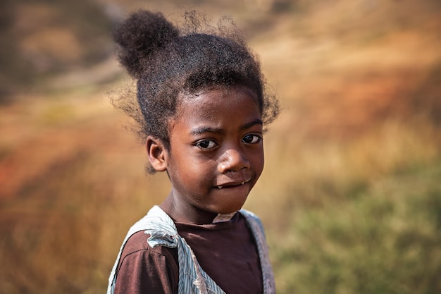 Portrait of an African girl from Madagascar. Poverty in Africa.