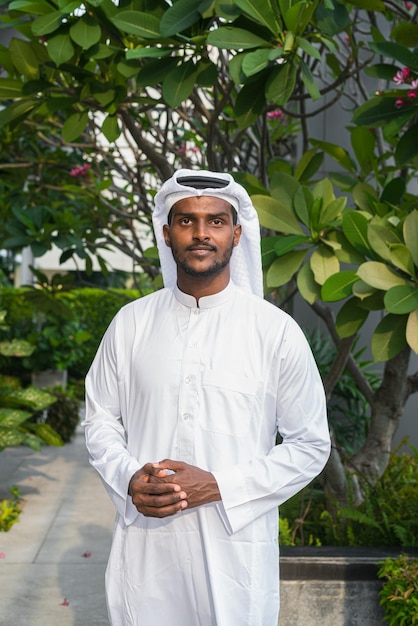 Portrait of African Muslim man wearing religious clothing an scarf at rooftop garden