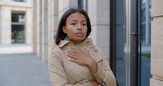 Portrait of african woman getting cold outdoors