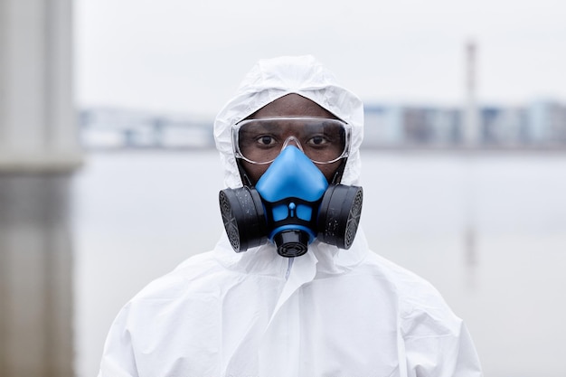 Portrait of africanamerican man wearing protective gear and looking at camera outdoors