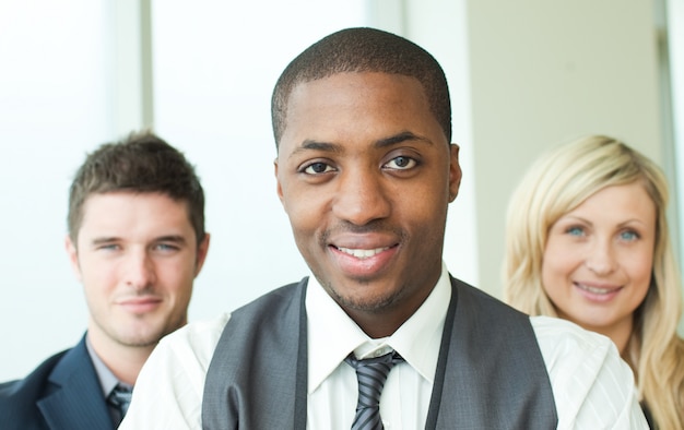 Portrait of an Afro-American businessman with his colleagues