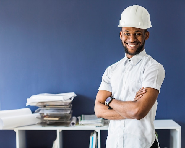 Portrait of an afro american male engineer wearing white hardhat