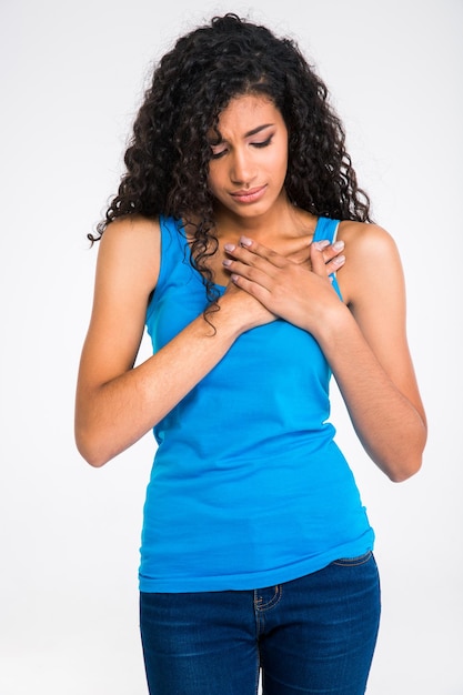 Photo portrait of afro american woman having pain in heart isolated