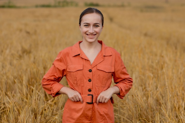 Portrait Agronomist farmer with digital tablet computer in wheat field.