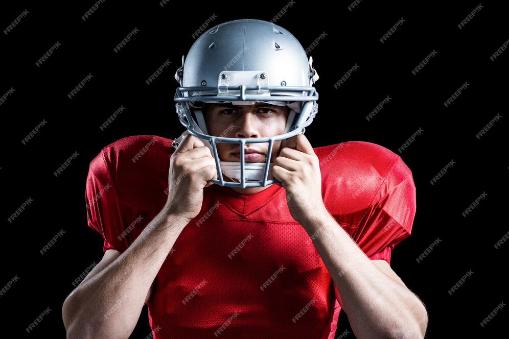 Premium Photo | Portrait of american football player holding helmet