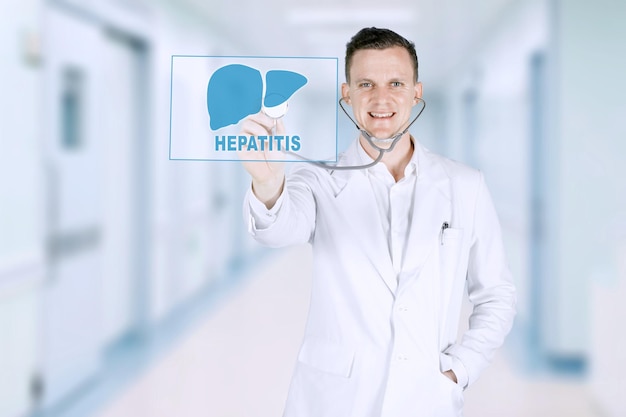 Portrait of American male doctor using a stethoscope while standing in the studio isolated on white background