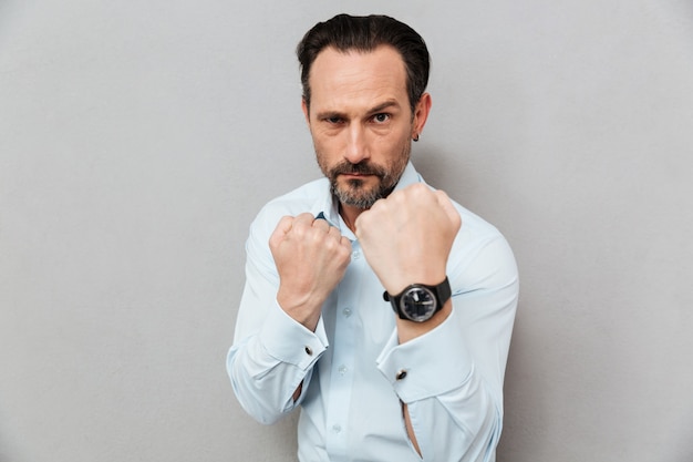 Portrait of an angry mature man dressed in shirt