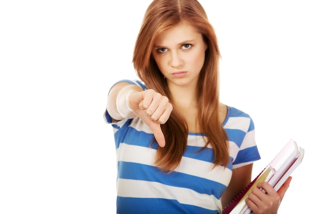 Photo portrait of angry woman holding book while gesturing against white background