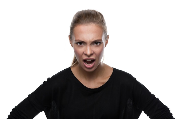 Portrait of angry woman on white background