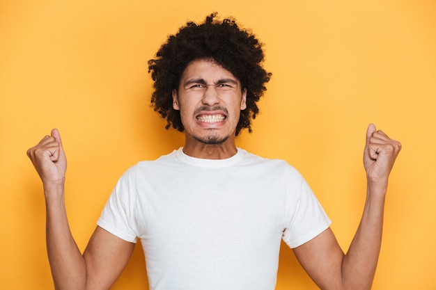 Portrait of an angry young african guy screaming