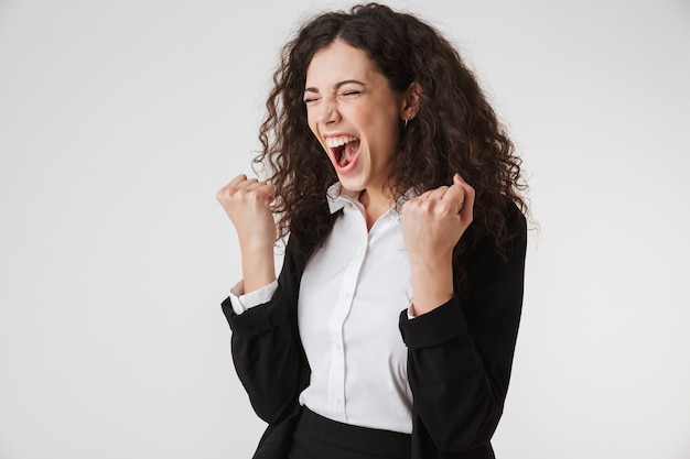 Portrait of an angry young businesswoman screaming