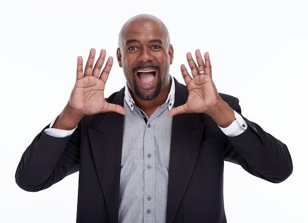 Portrait announcement and a business black man shouting in studio isolated on a white background corporate work Voice excited and surprise with a senior male speaker giving a speech for motivation